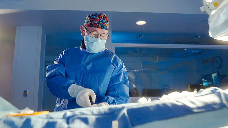 Male surgeon performs task in operation room